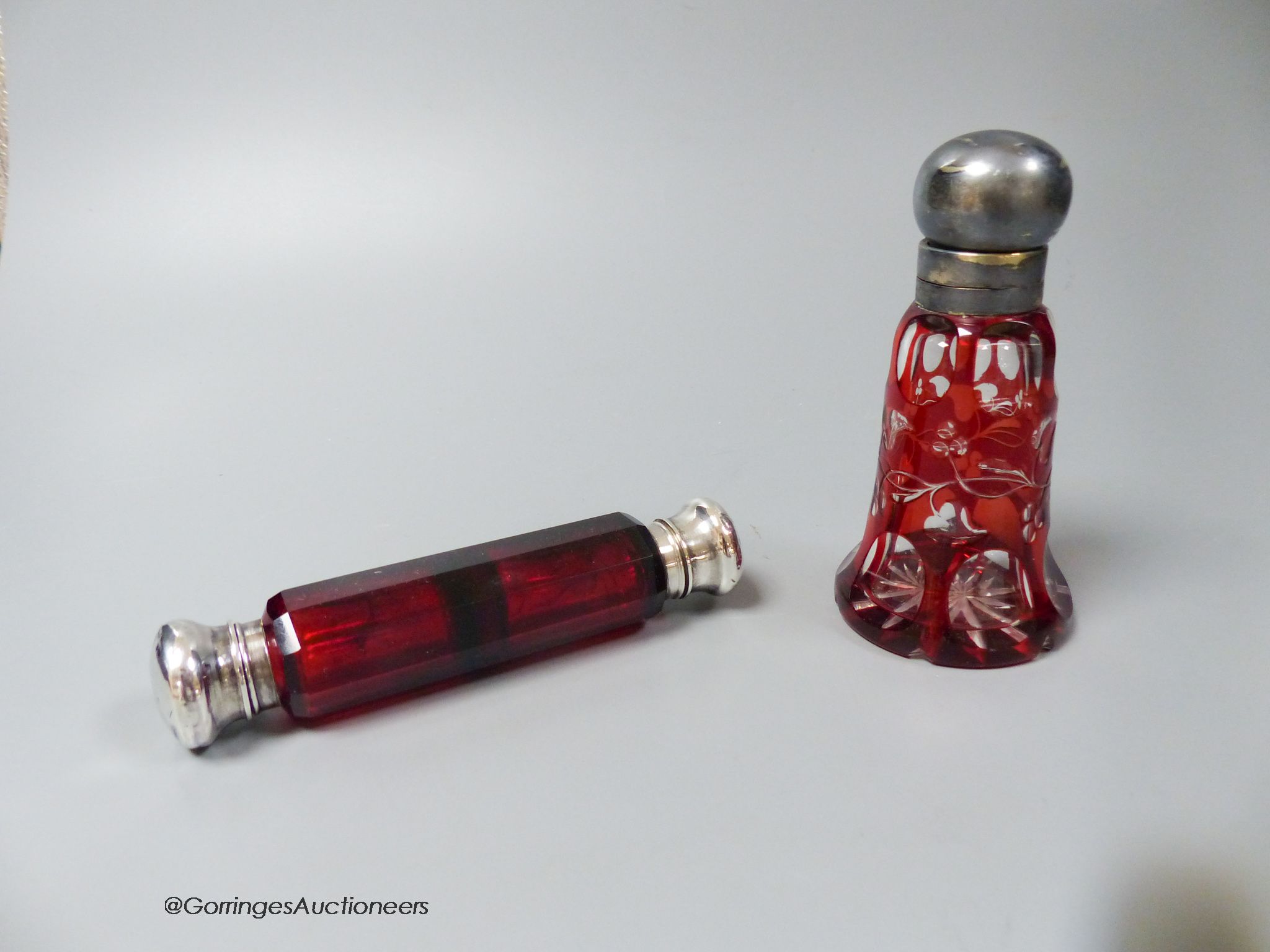 A Victorian ruby glass double silver mounted scent bottle and a plate mounted flash cut ruby scent bottle (2)